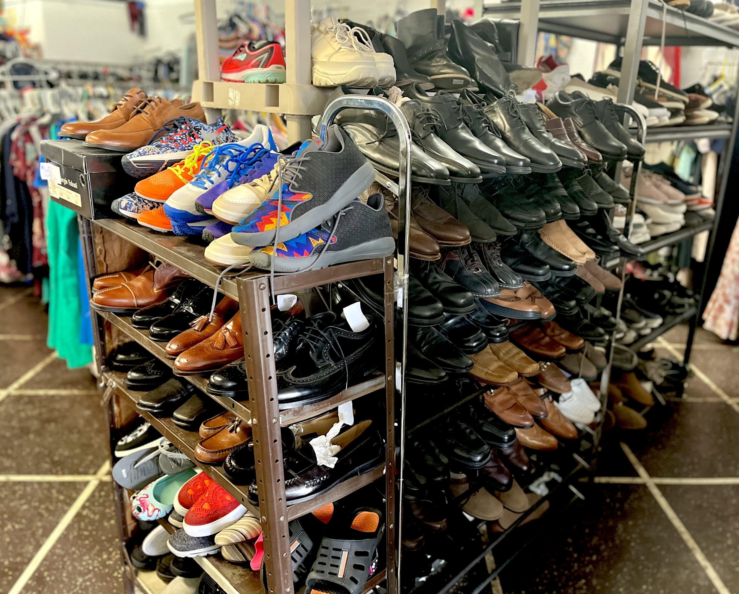 Numerous pairs of men's and women's shoes of various styles and colors.